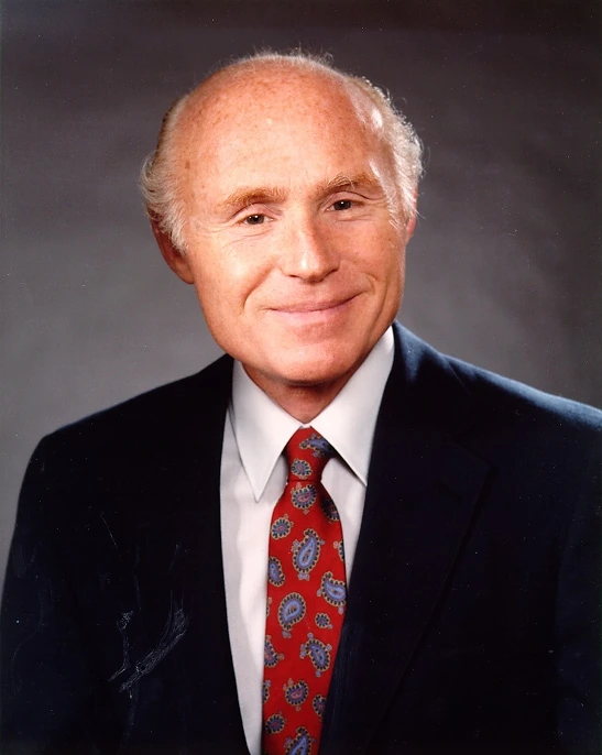 Portrait photo of Herb Kohl in a suit and tie