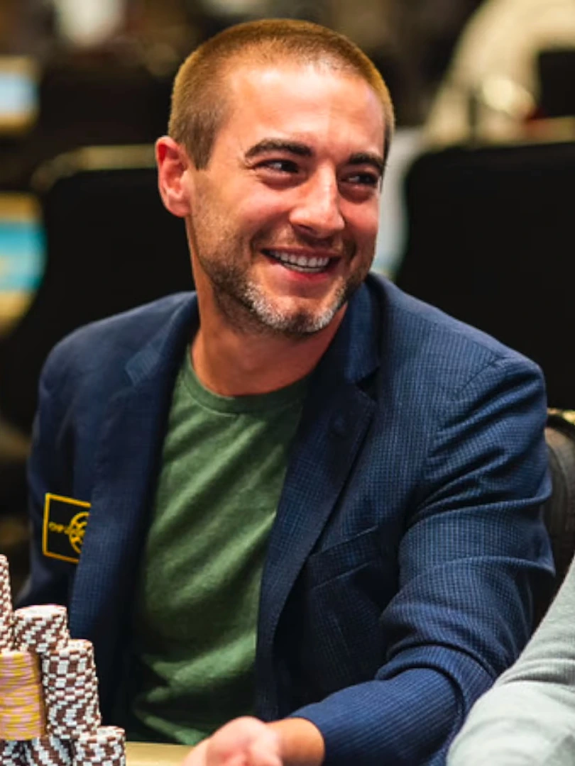 Chance Kornuth smiling at a poker table
